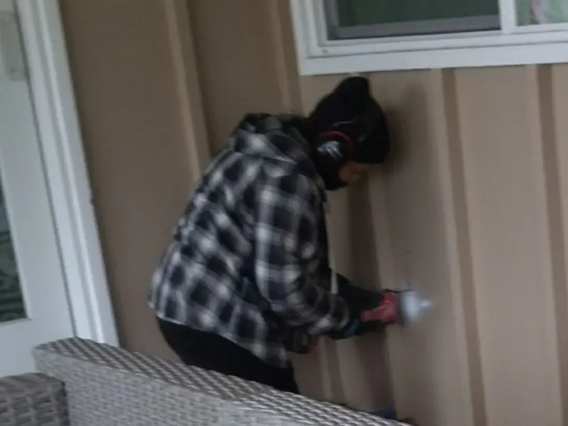 Professional electrician installing an exterior outlet in Bee Cave